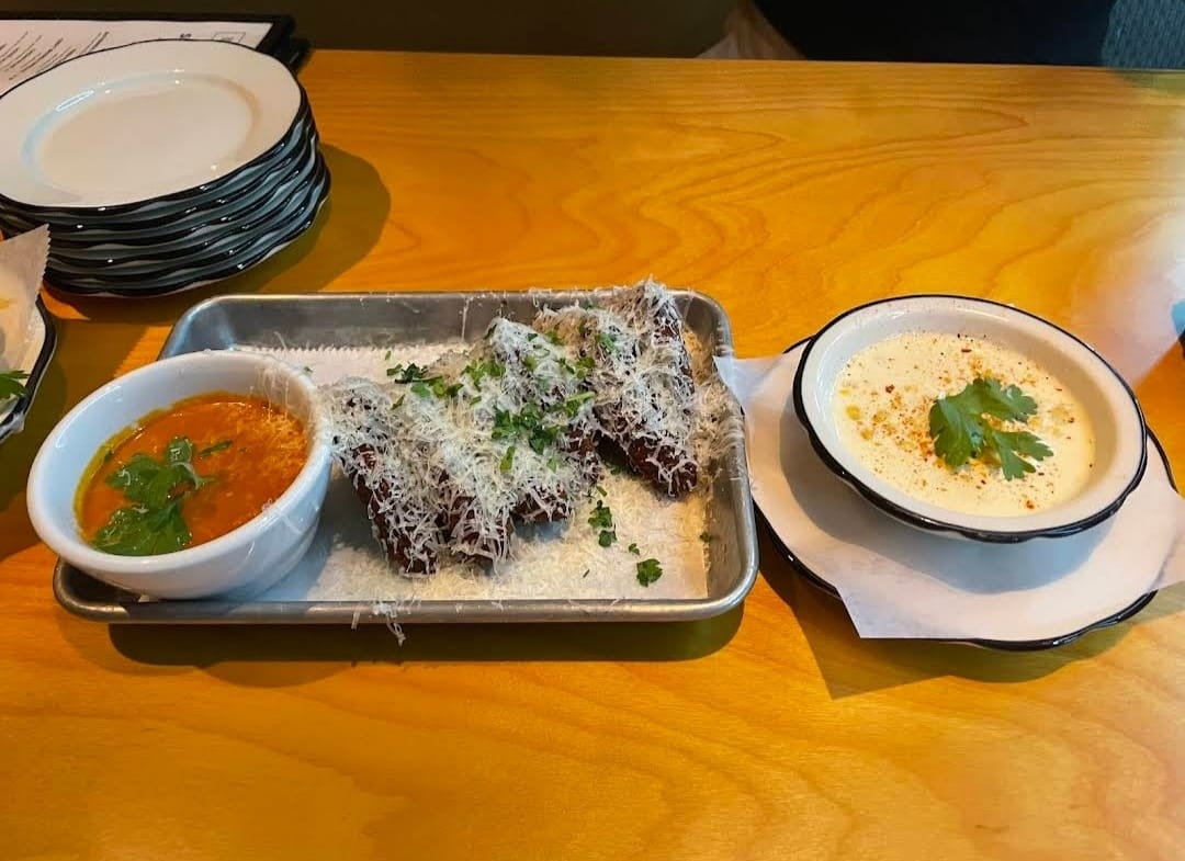 Crispy Chicken Wings with Dipping Sauces at Black Tap Miami