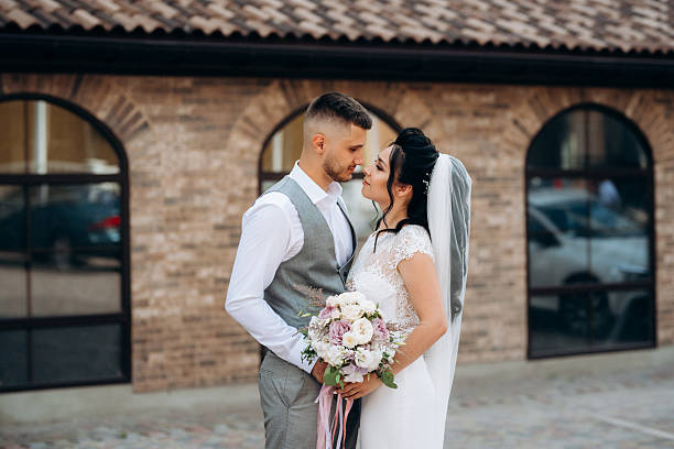 young couple, the bride and groom a walk of a young couple, the bride and groom cages wedding dress stock pictures, royalty-free photos & images